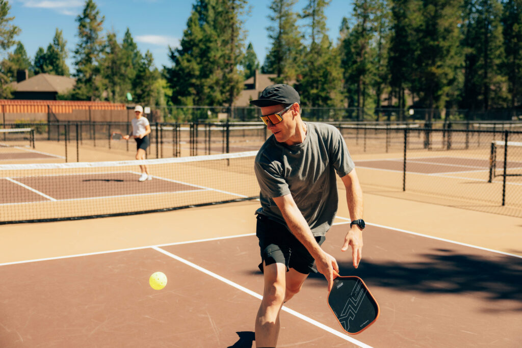 Man playing pickleball at one of the Sunriver Resort courts. Man playing pickleball at one of the Sunriver Resort courts.