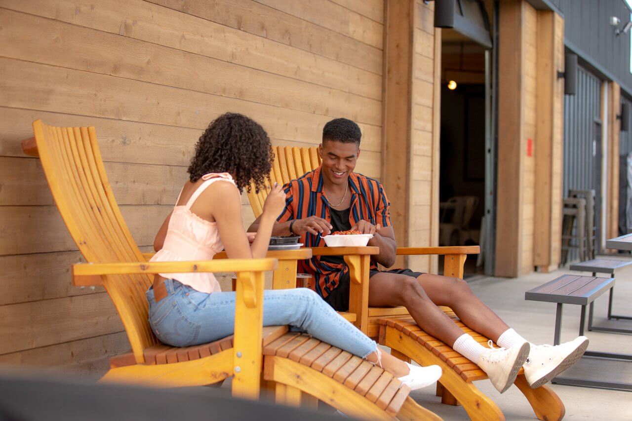 Couple enjoying food on the patio at General Duffy’s Waterhole. Couple enjoying food on the patio at General Duffy’s Waterhole.